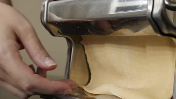 Pasta machine in the kitchen slow motion  1920X1080 HD footage -  Making of Italian lasagna from dou
