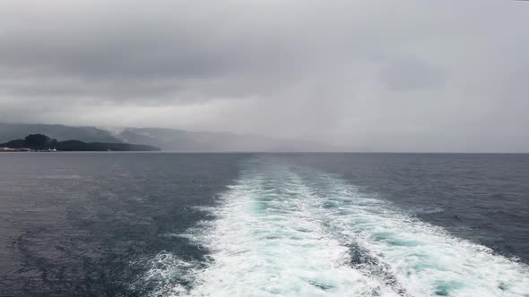 Water Trail Foaming Behind a Ferry