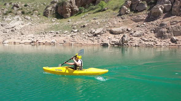 Man Canoeing On The Lake