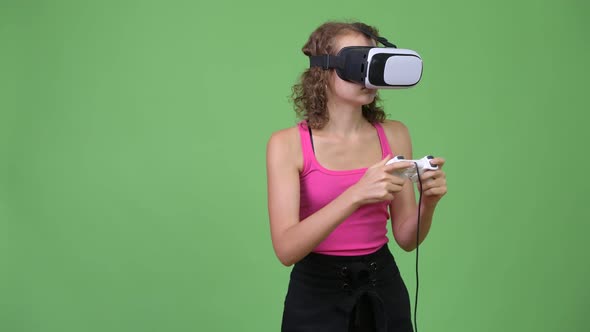 Young Beautiful Nerd Woman Playing Games and Using Virtual Reality Headset