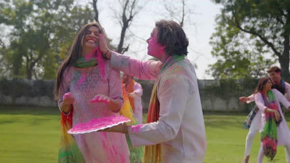 Happy Indian people playing Holi