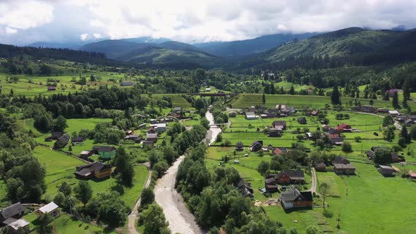 Carpathian Mountains with River and Beautiful Vintage Wooden Houses