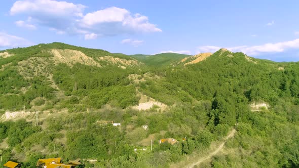 Green mountain and city landscape