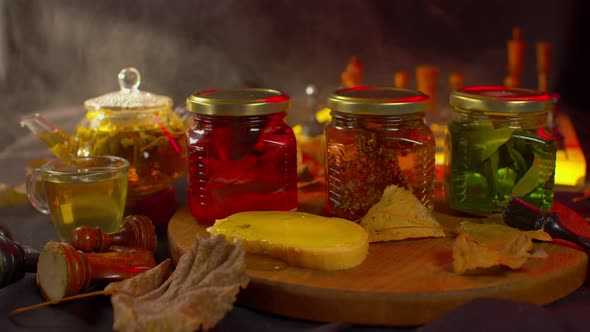 Close Up of Three Jars of Fresh Jam on Black Background with Illuminated and Steam