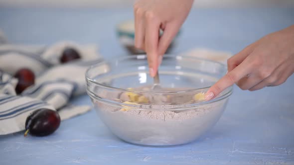 The process of making shortbread dough for pie.