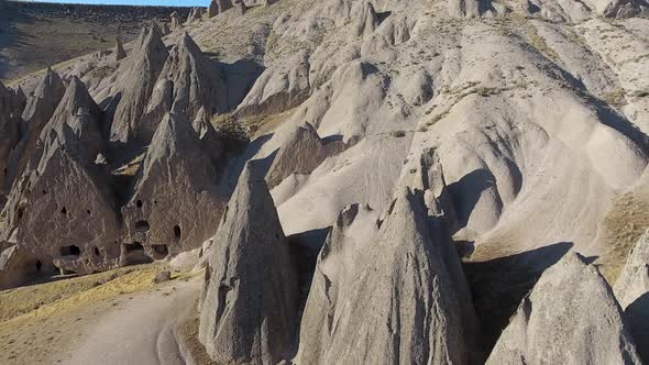 Hoodoos, Fairy Chimneys and Historical Cave Houses in Sedimentary Volcanic Rock Formations