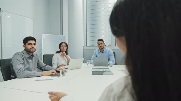 Confident Speaker Coach Gives Corporate Presentation Teaching Diverse Sales Team Employees at Group