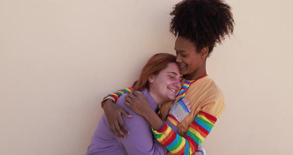 Multiracial lesbian couple having tender moment together - Homosexual love concept