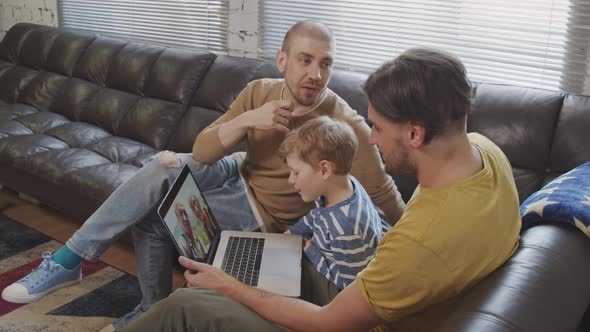 Fathers and Child Talking on Video Call with Elderly People