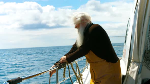 Fisherman removing a buoy into the sea