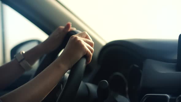 Woman Driver Hand On Car Steering Wheels. Using Windshield Wiper And  Car Wheel. Travelling Vacation