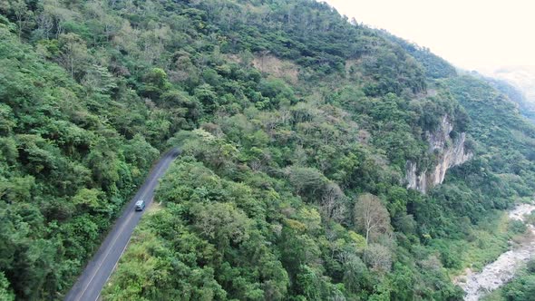 Traveling by Van Through the Foggy Jungle