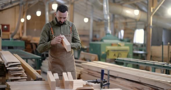 Man Working with Wood at the Joinery