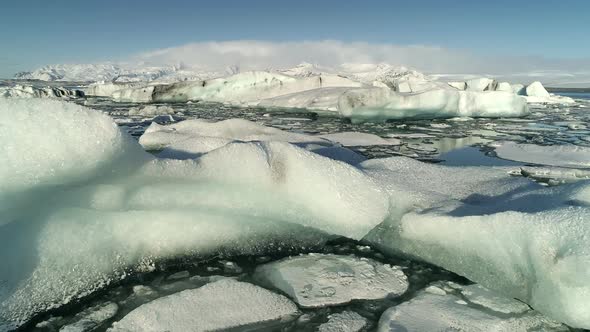 Flying Above Floating Icebergs