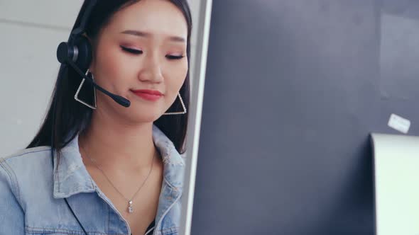 Customer Support Agent or Call Center with Headset Talking to Customer on Phone