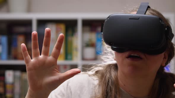 Close-up of a girl wearing virtual reality glasses on her head