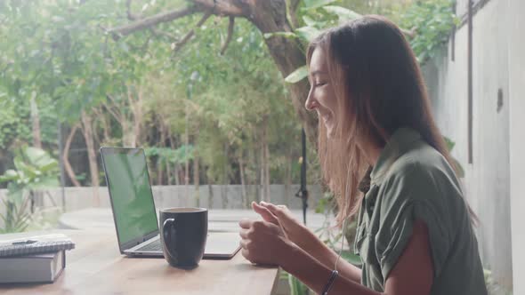 Woman Video Calling on Summer Terrace