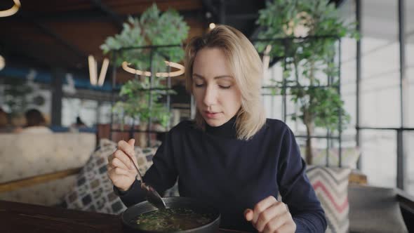 Attractive Blonde in a Restaurant