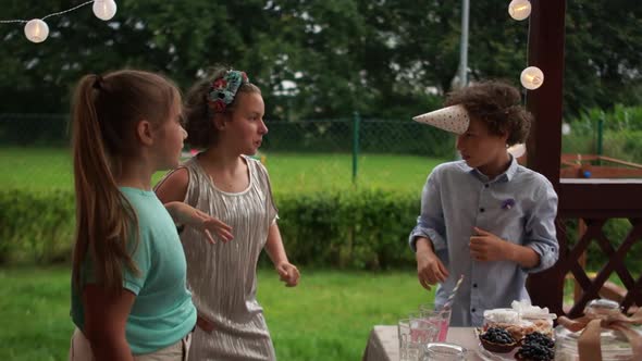 Cheerful Teenagers Dancing at a Birthday Party