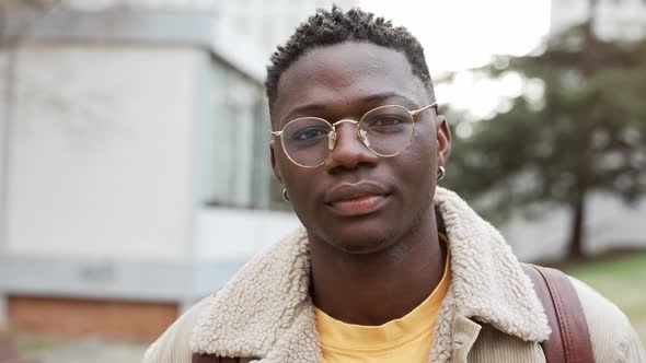 Positive Young African American Man with Trendy Eyeglasses