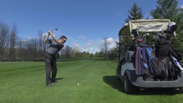 golfing man drives a ball slider view 4k smooth