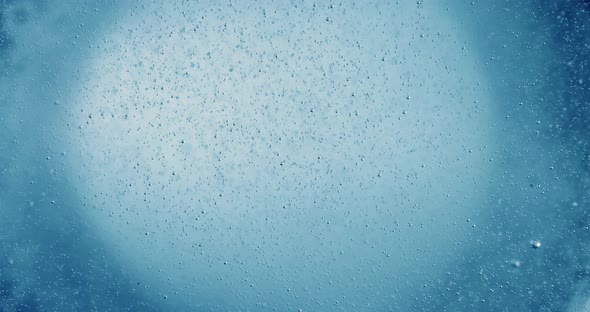 Oxygen Bubbles in Water on a Blue Abstract Background