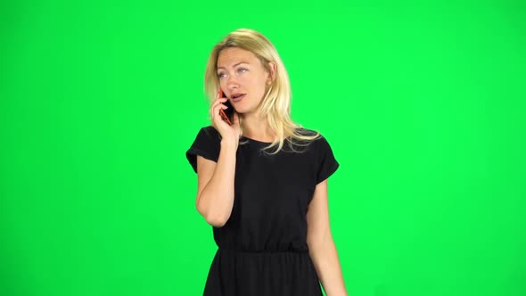 Woman Goes and Speaks on the Phone. Chroma Key. Slow Motion