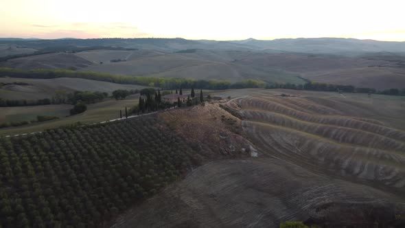 Val d'Orcia Rolling Hills and Farmhouse in Countryside Tuscany Aerial View