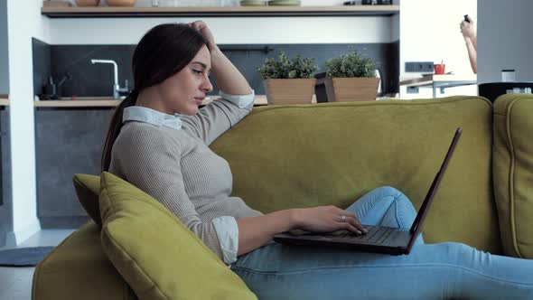 Relaxed Businesswoman Using Laptop Device Business Correspondence Sofa at Home Office Focused