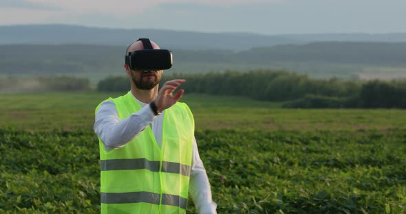 Farm Specialist Engineer Using Technology VR Monitoring Harvest Working for Agriculture Productivity