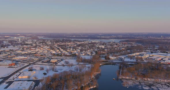 Aerial View of a Snow Covered Town Houses and Streets on a Bright Sunny Winters Day
