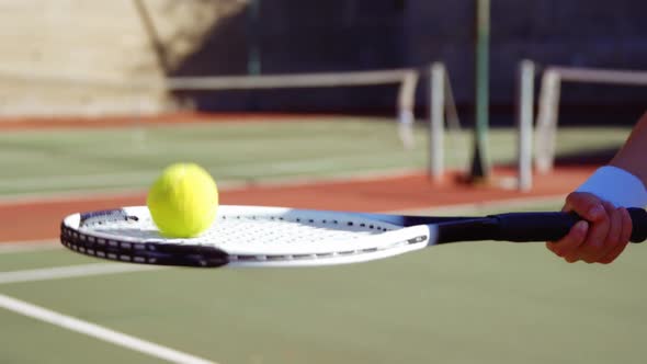 Active sportswoman playing tennis