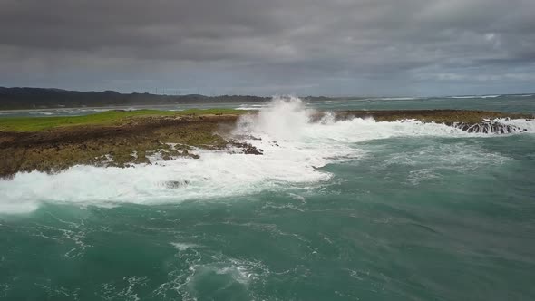 Aerial view of crashing waves on Mokuauia Islet Seabird Sanctuary