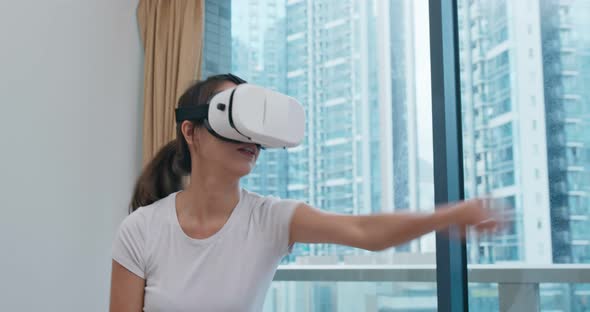 Woman Play Boxing Game and Wearing VR Device