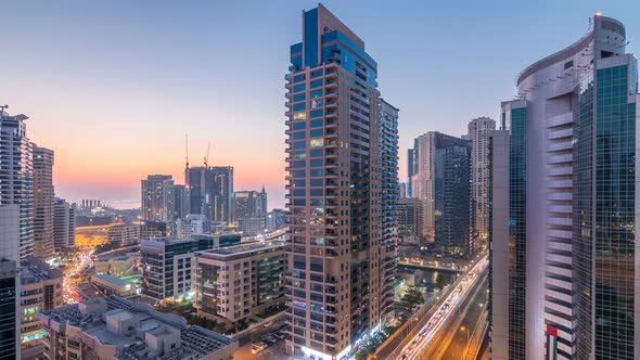 Aerial View of Dubai Marina After Sunset From a Vantage Point Day to Night Timelapse