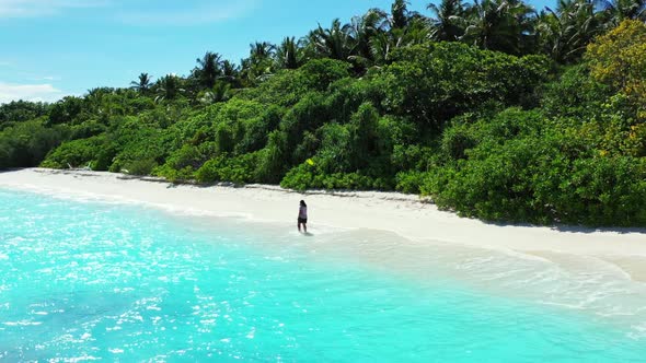 Girl loves life on idyllic island beach voyage by clear sea with clean sandy background of the Maldi