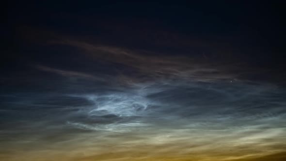 A Timelapse of Silvery Clouds at Night