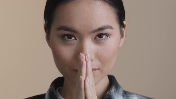 Female Portrait Asian Girl Folds Palms in Front of Her Bows Oriental Greeting Doing Reverence