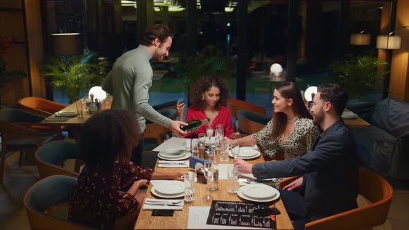 Friends Enjoy Drink Together in Restaurant