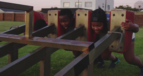 Young adult female rugby players training