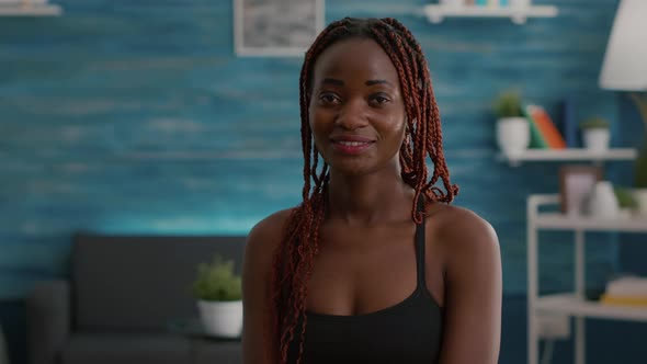 Portrait of Athlete with Black Skin Looking Into Camera While Siting on Aerobics Ball