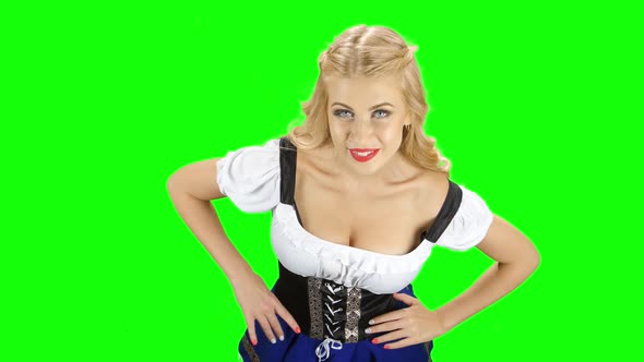 Girl in Bavarian National Costume with Someone Flirting. Green Screen