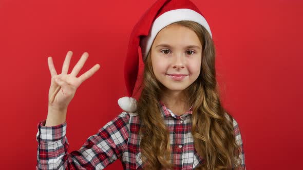 Girl On a Red Background Counts Seconds On The Fingers