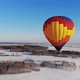 Aerial Shot of the People Fly on a Big Bright Balloon Over the Winter Forest - VideoHive Item for Sale