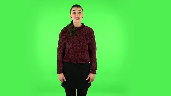 Girl Is Surprised at What Is Happening Around, Looking with Delight and Admiration. Green Screen