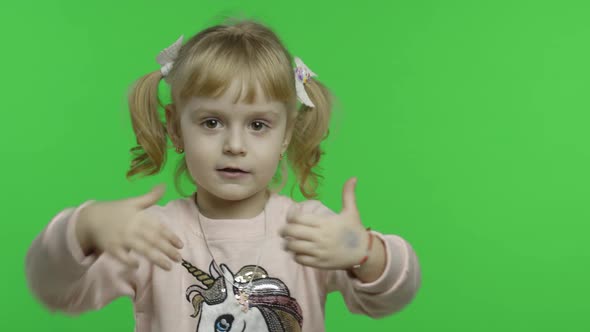 Girl in Unicorn Sweatshirt. Child Show Thumbs Up. Chroma Key