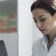 Female doctor working with a laptop in her office - VideoHive Item for Sale