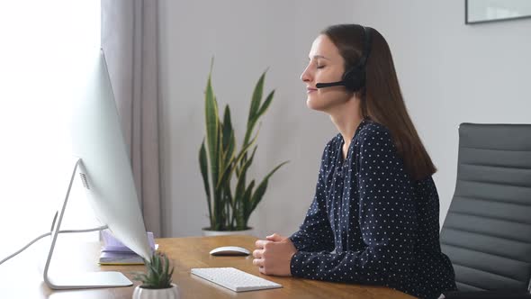 Woman is Using Headset for Online Communication