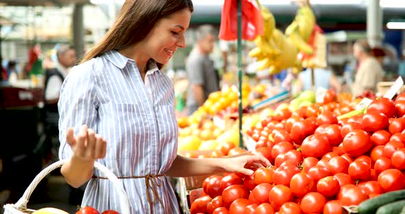 Picture of Woman at Marketplace Buying Vegetables