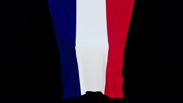 The piece of cloth falls with the flag of the State of France to cover the product